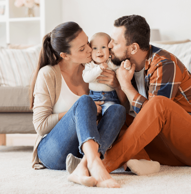 Happy couple with their baby after surrogacy match in Ontario