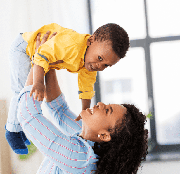 Intended mother lovingly holding her baby